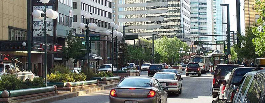 Cars and a bus in traffic on a downtown Edmonton street